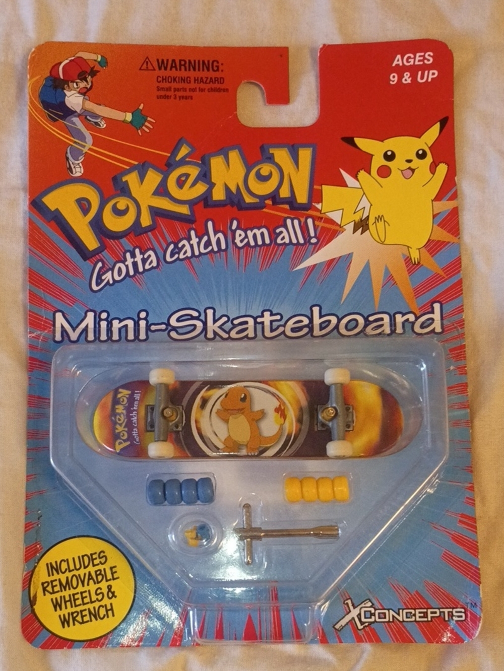 This is a sealed 1999 Pokémon Charmander mini-skateboard produced by X-Concepts.